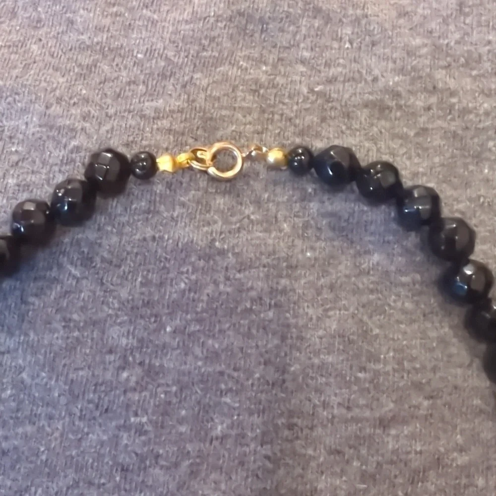 Women's black, pink‎ and clear ball necklace.